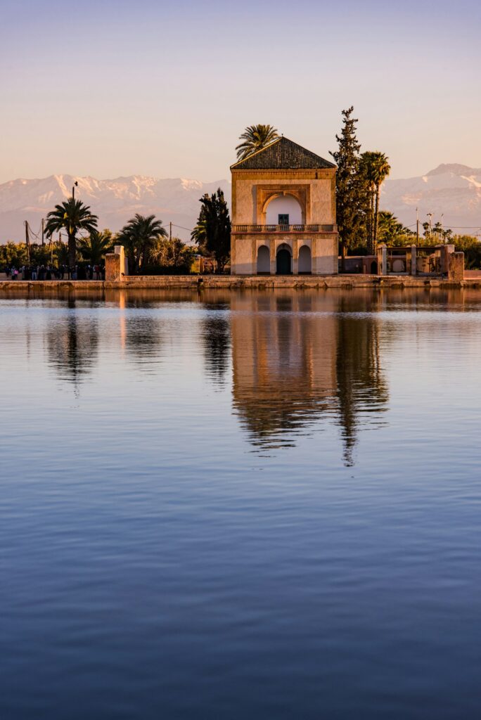 Menara Gardens Pavilion reflect in water at sunset,Morocco