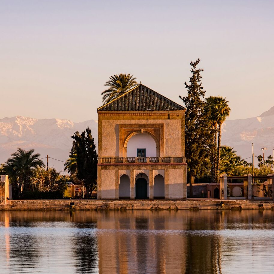 Menara Gardens Pavilion reflect in water at sunset,Morocco